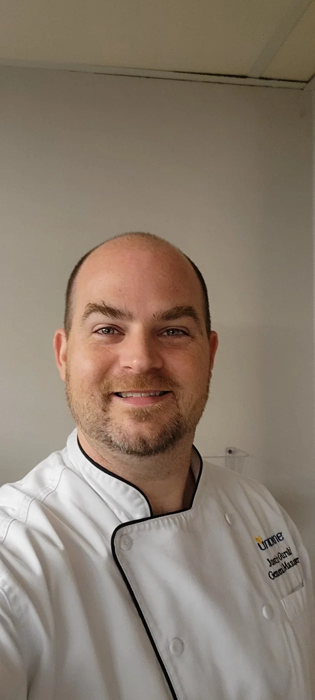 Justin in a chef coat during his hospitality career